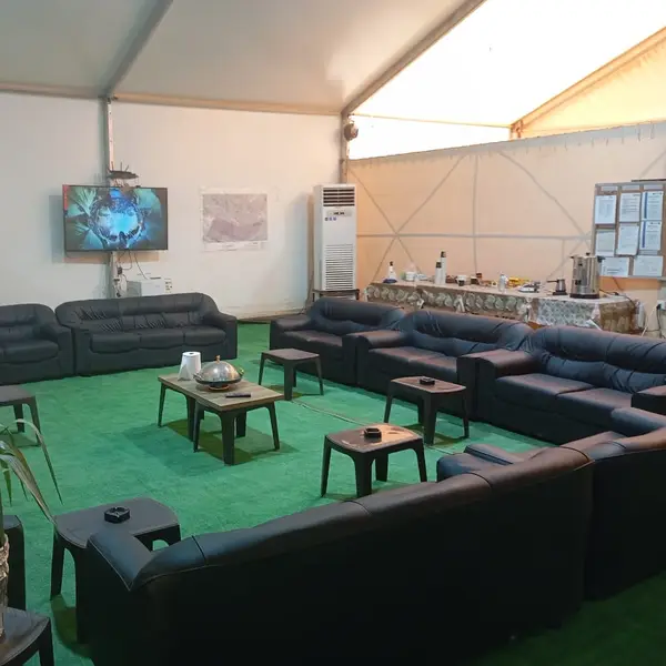 Air-conditioned crew lounge with seating and a television