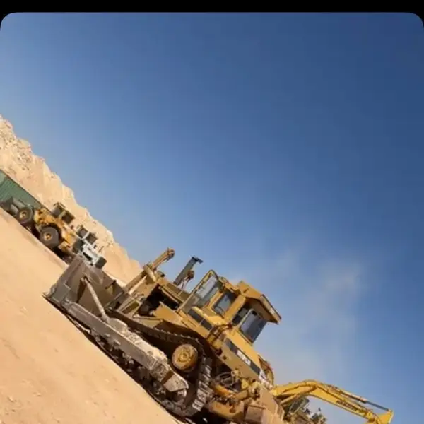 Bulldozer and excavator preparing a desert site